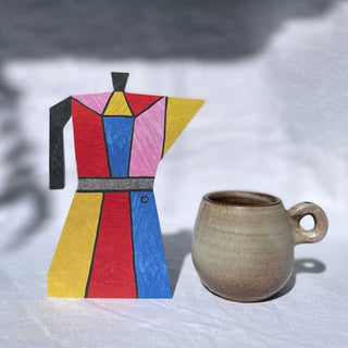 Espressokannen-Karte von Mortlake Papers neben einer Keramiktasse